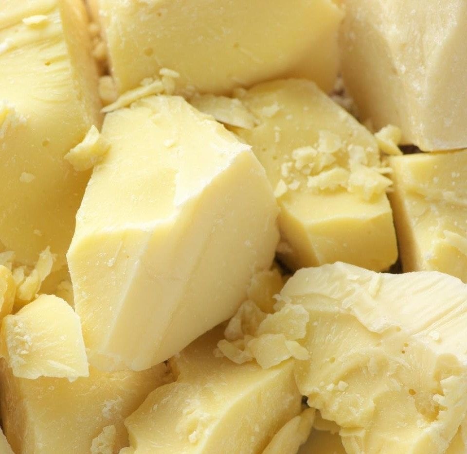 Close-up of pale shea butter pieces